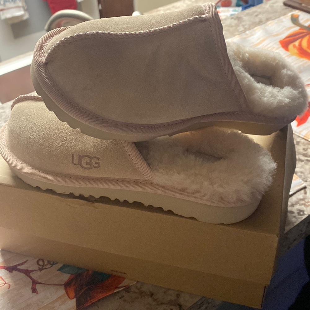 Kids light pink ugg slippers brand new in box.